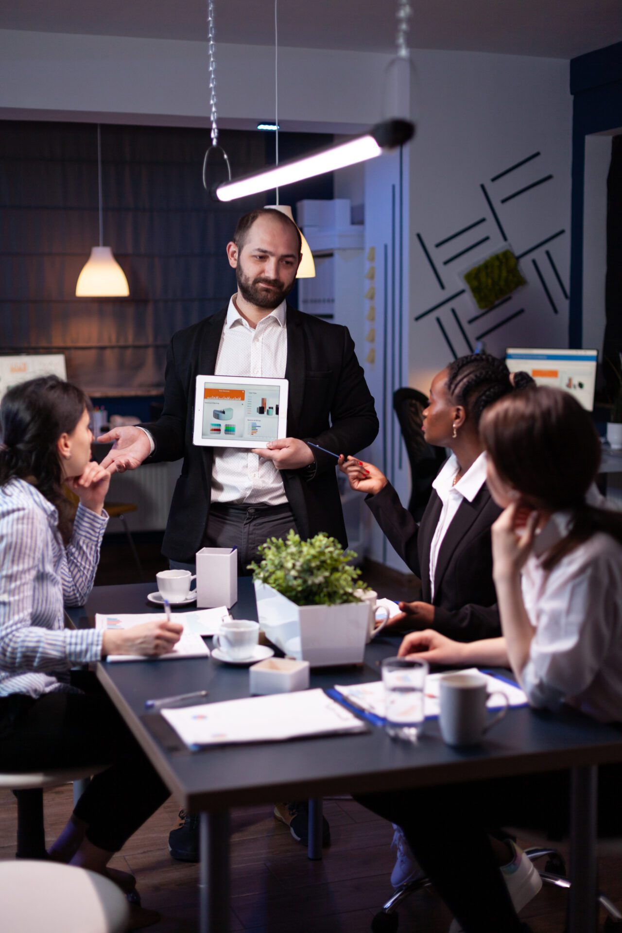 Business entrepreneur man presenting company statistics using tablet for financial presentation